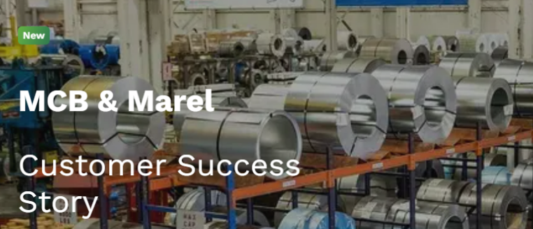 Steel coils stored in an industrial warehouse, representing MCB and Marel customer success story in manufacturing and supply chain optimization.